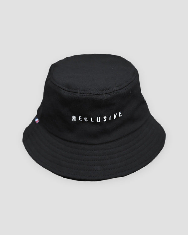 Black bucket hat with RECLUSIVE embroidered in white across the front