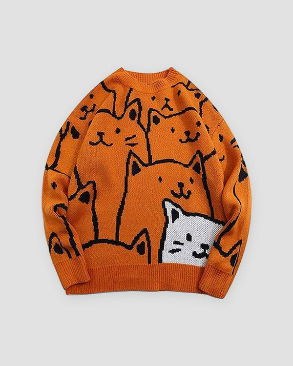 Orange knit sweater covered in black line-drawn cat faces with one white cat at the lower right, front view