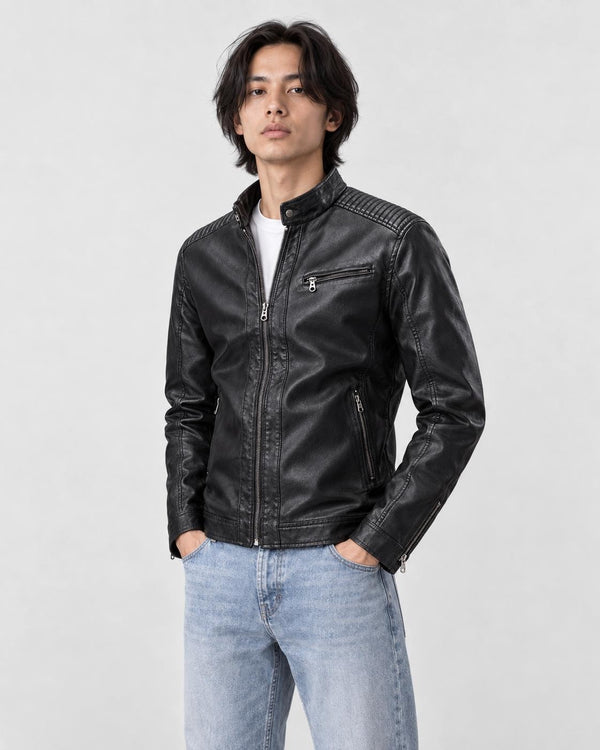 Model wearing the black PU leather biker jacket with a white tee and light-wash jeans, three-quarter view