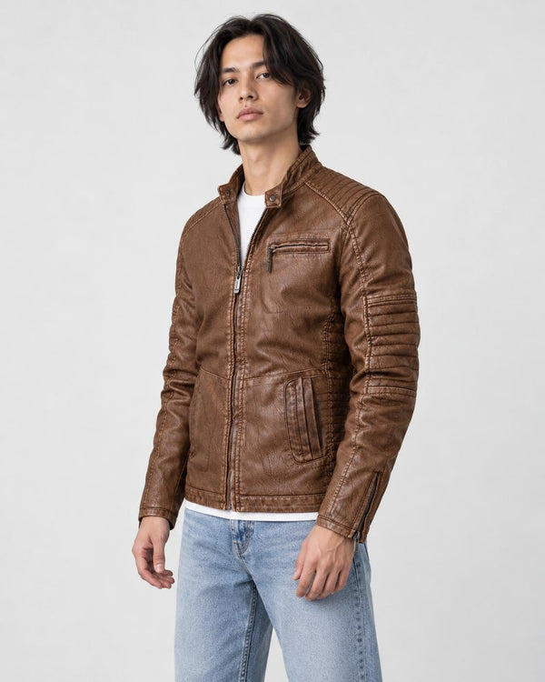 Model wearing the brown PU leather biker jacket over a white tee with light jeans, three-quarter view