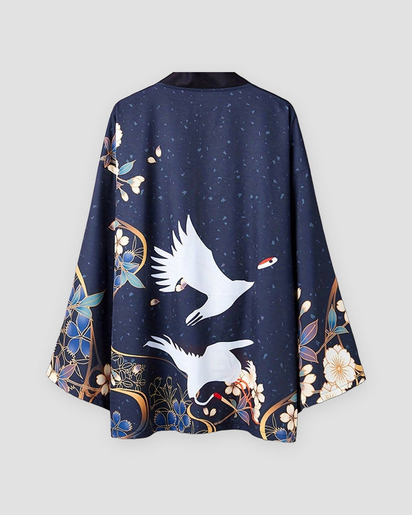 Dark navy haori jacket on a hanger, back view with two white cranes above a gold ring and blue and cream flowers at the hem