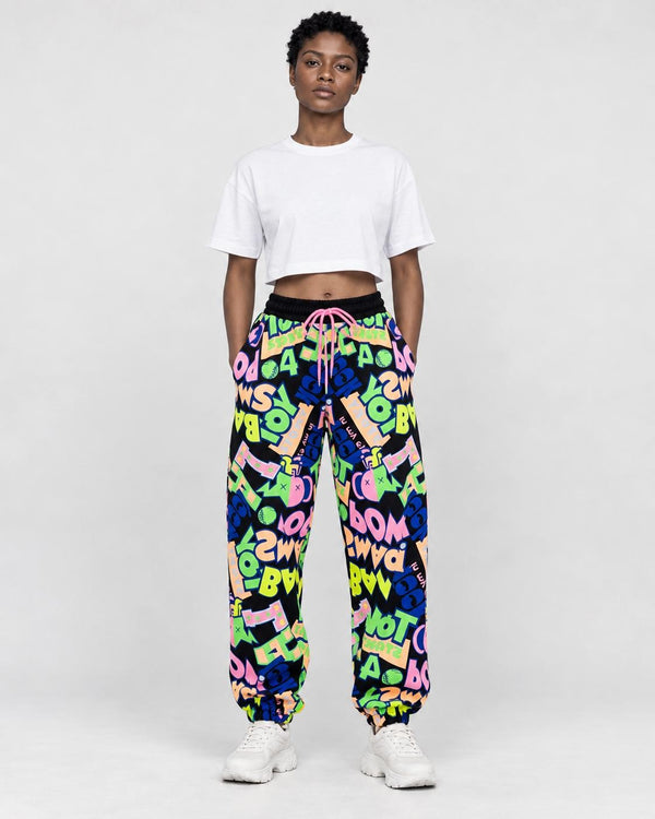 Model wearing the black-ground neon graffiti jogger pants, front view