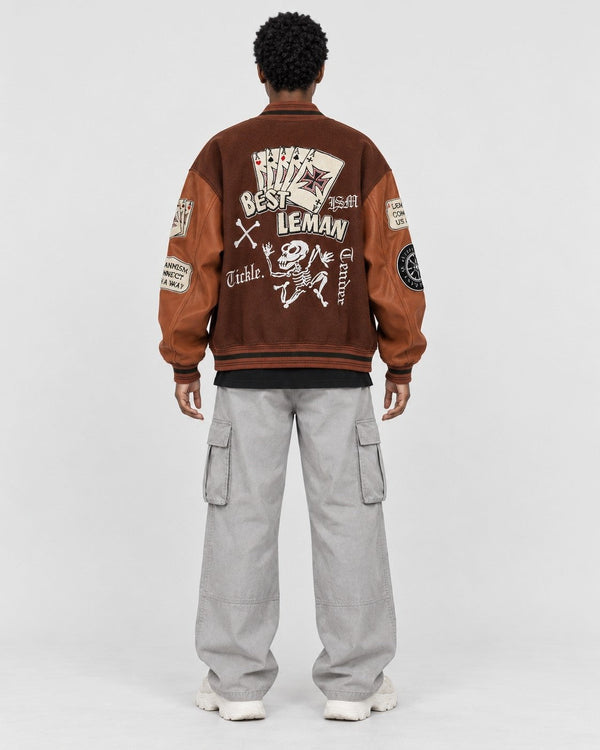 Back of the brown varsity jacket with chenille playing cards, BEST LEMAN and a dancing skeleton