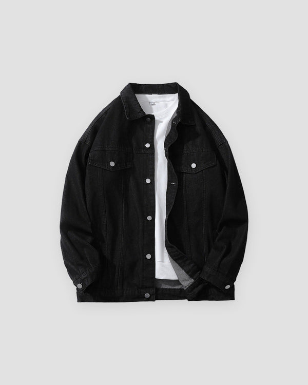 Black relaxed denim trucker jacket, front view, open over a white tee