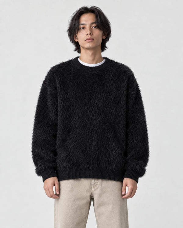 Model wearing the black shaggy knit crewneck sweater, front view