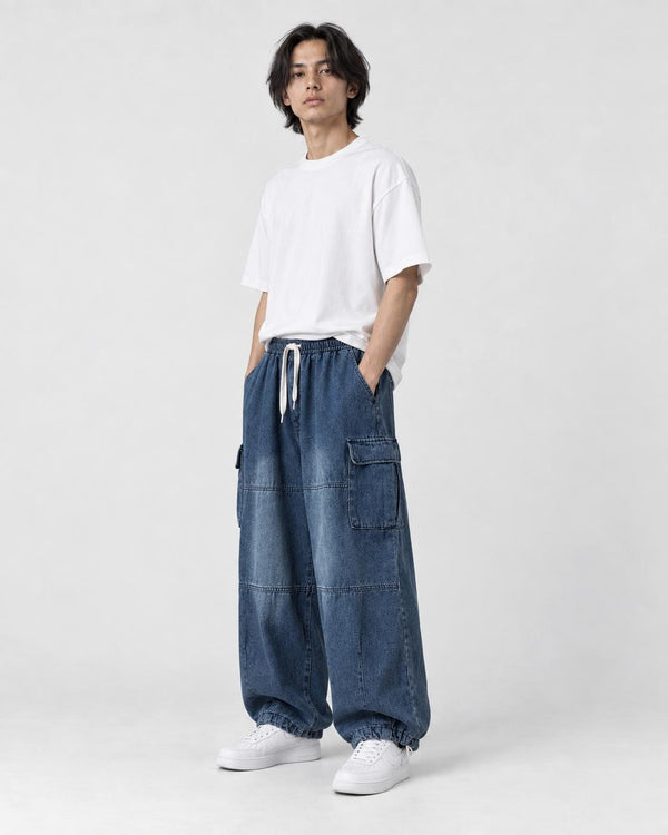 Model wearing the blue cargo jeans, three-quarter view of the thigh pocket