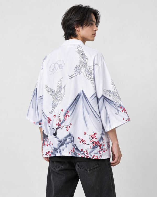 Man in the white haori seen from behind at an angle, with gray mountains, white cranes and red plum blossoms, black tee