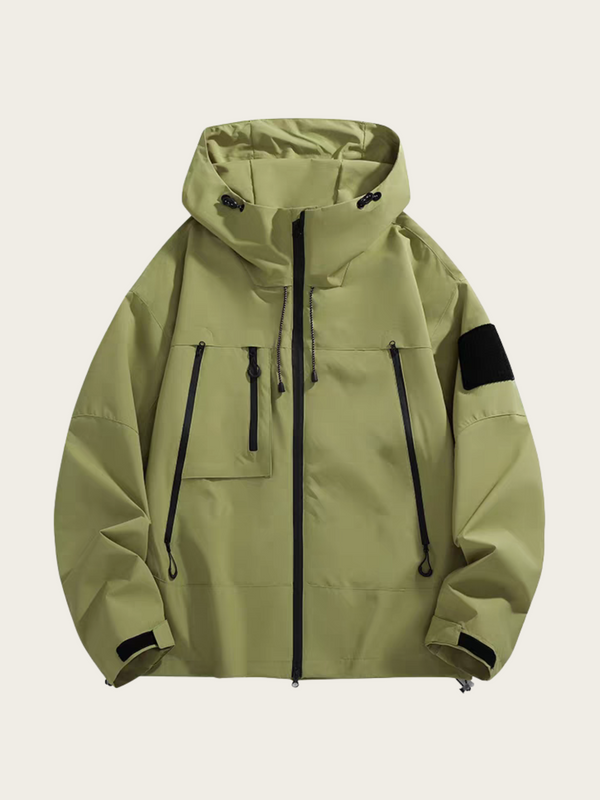 Green jacket with black zippers and accents on a beige background