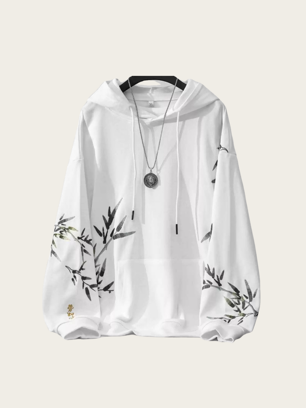 White hoodie with black floral patterns on sleeves against a white background
