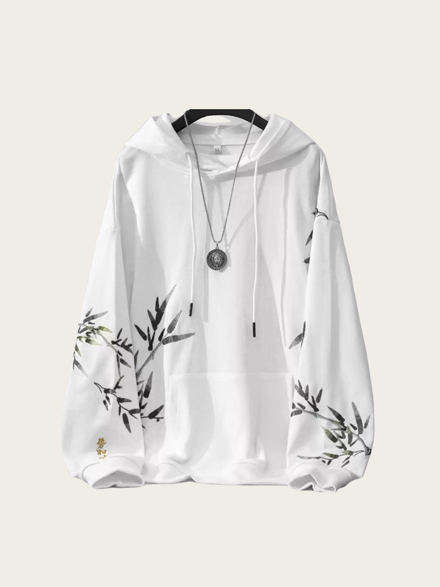 White hoodie with black floral patterns on sleeves against a white background