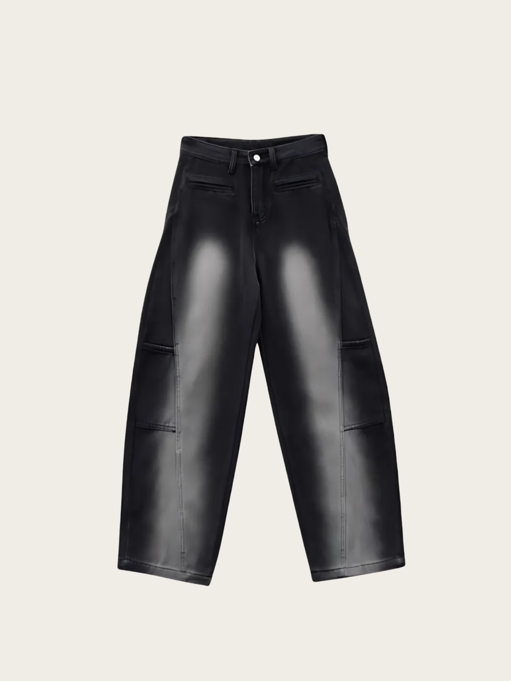 Black leather pants on a light beige background