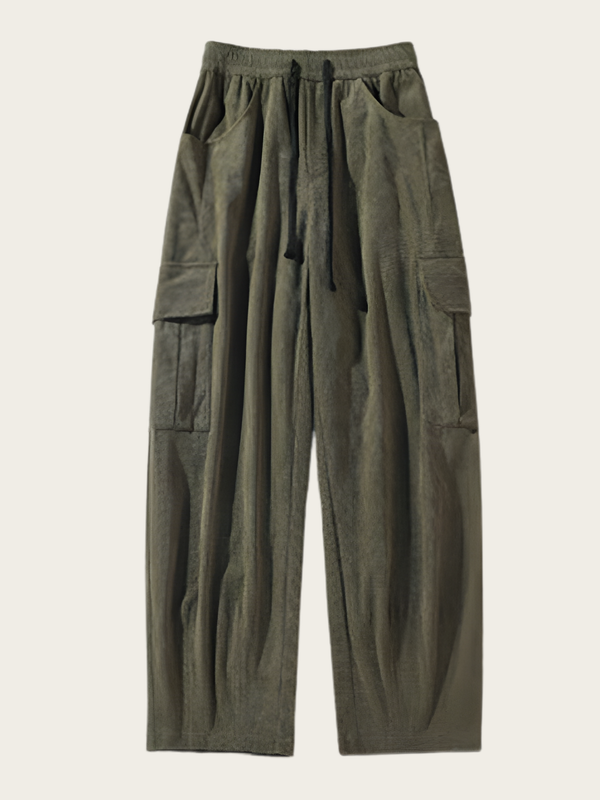 Green cargo pants on a light beige background
