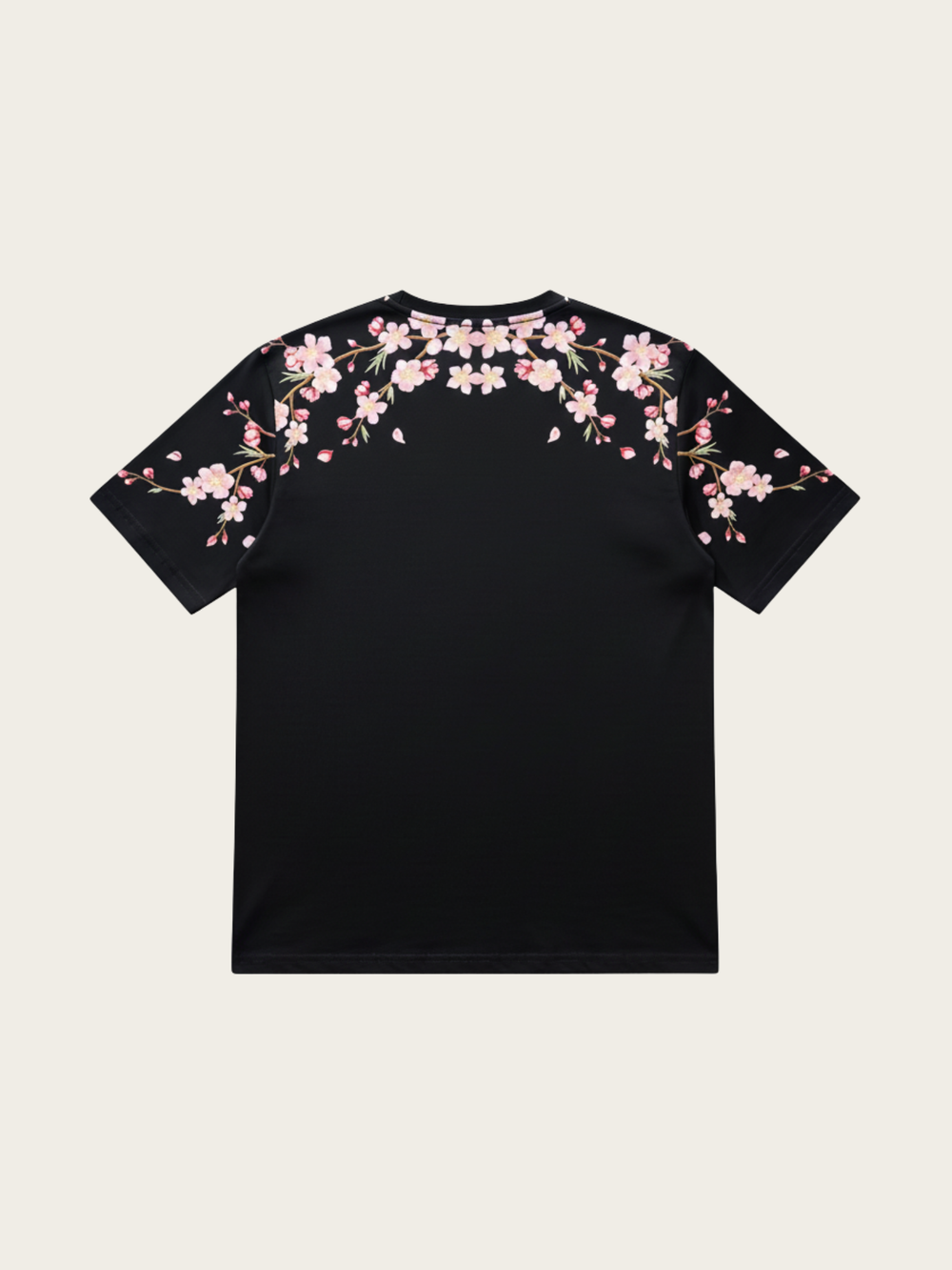 Black t-shirt with pink floral designs on a beige background