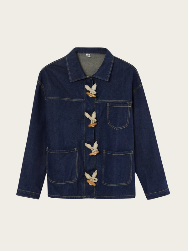 Dark blue denim jacket with button details on a light beige background