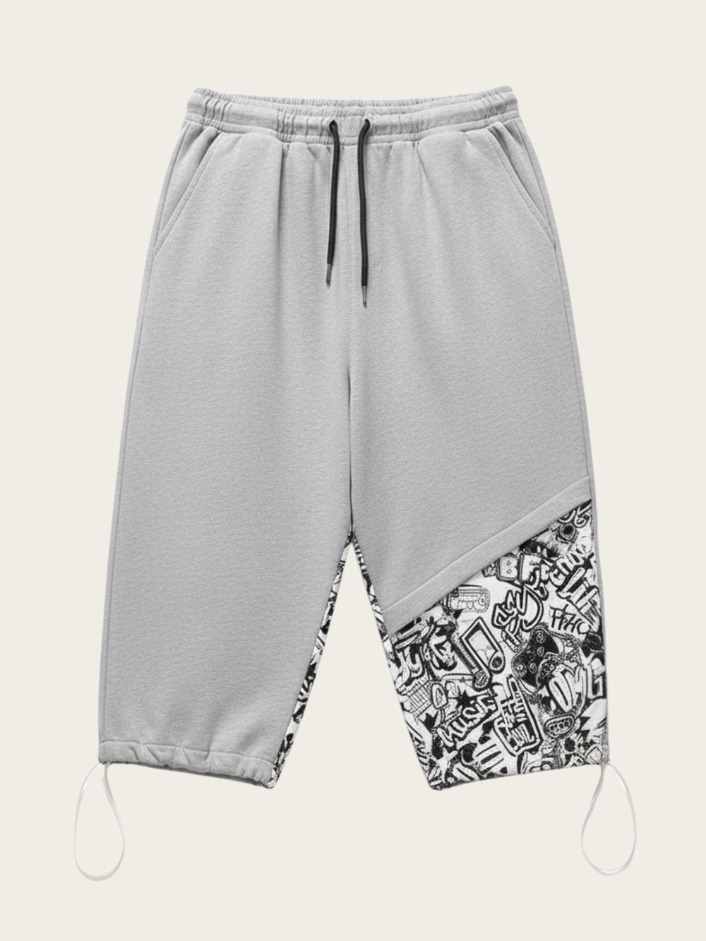 Gray sweatpants with a patterned bottom section on a white background