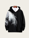 Black hoodie with white feather design on a beige background