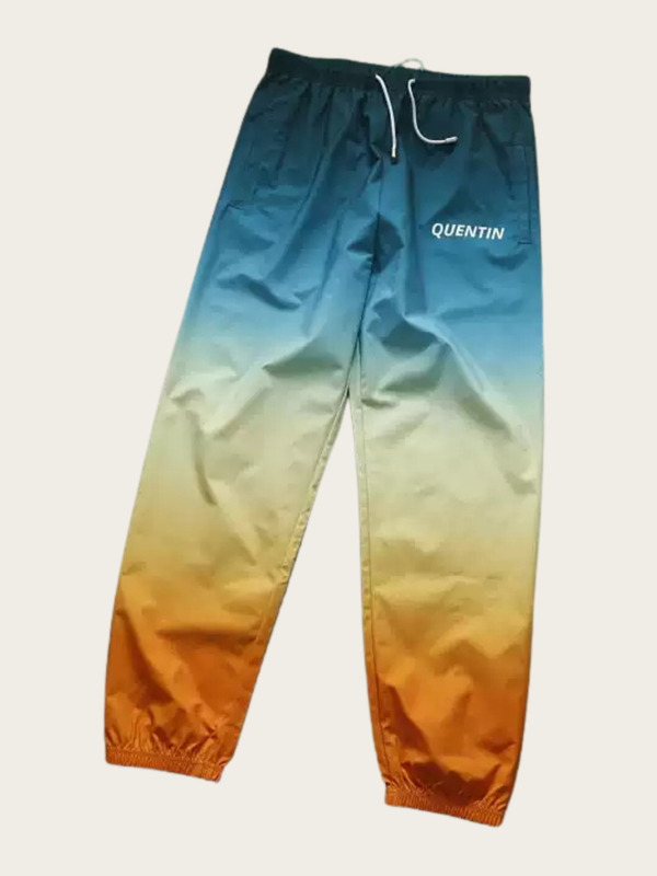 Gradient blue to orange pants with 'QUENTIN' branding on a light gray background
