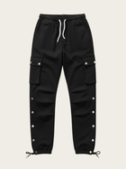 Black cargo pants with button details on a beige background