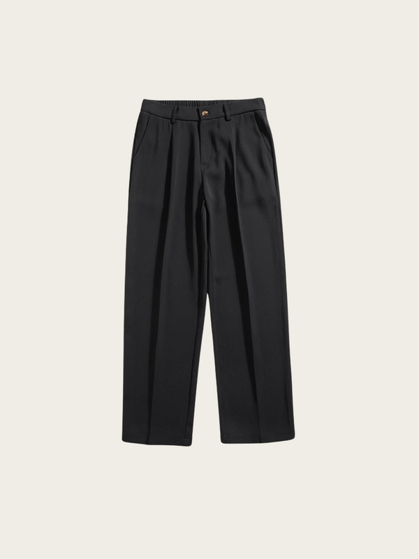 Black pleated pants on a light beige background