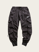 Black cargo pants on a light gray background