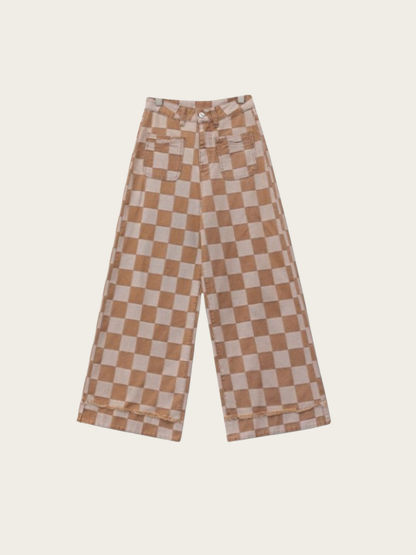 Checkered pants with brown and white pattern on a beige background