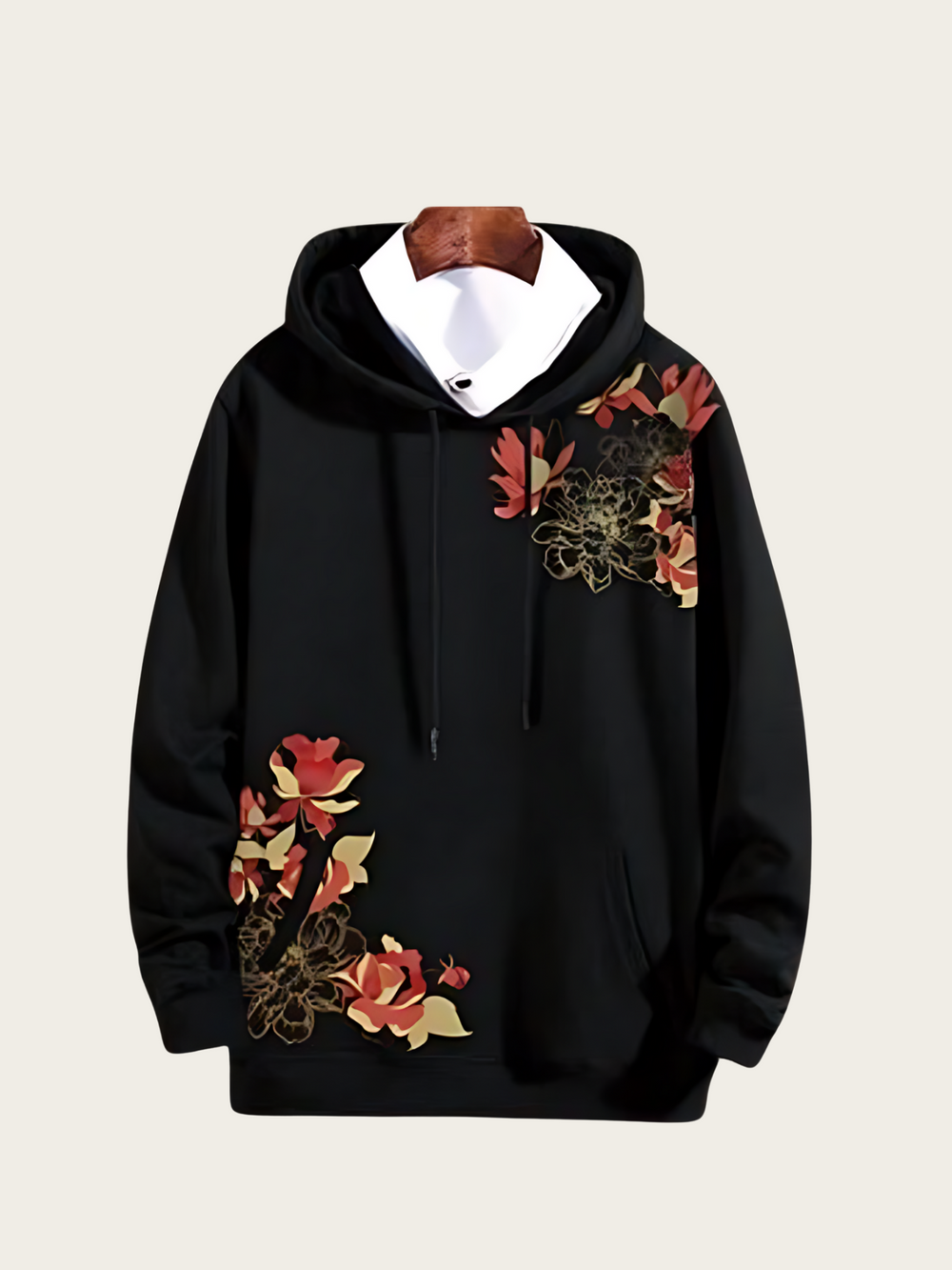 Black hoodie with floral embroidery on a beige background