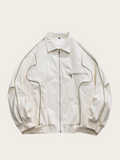 White jacket with black accents on a light beige background