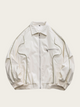 White jacket with black accents on a light beige background