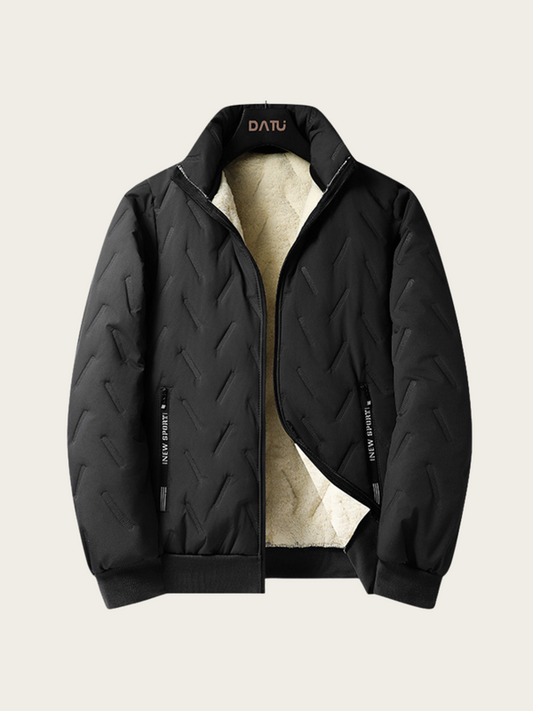Black quilted jacket with beige lining on a light gray background