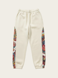 Beige sweatpants with colorful side panels on a white background