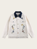 White jacket with floral embroidery on a white background