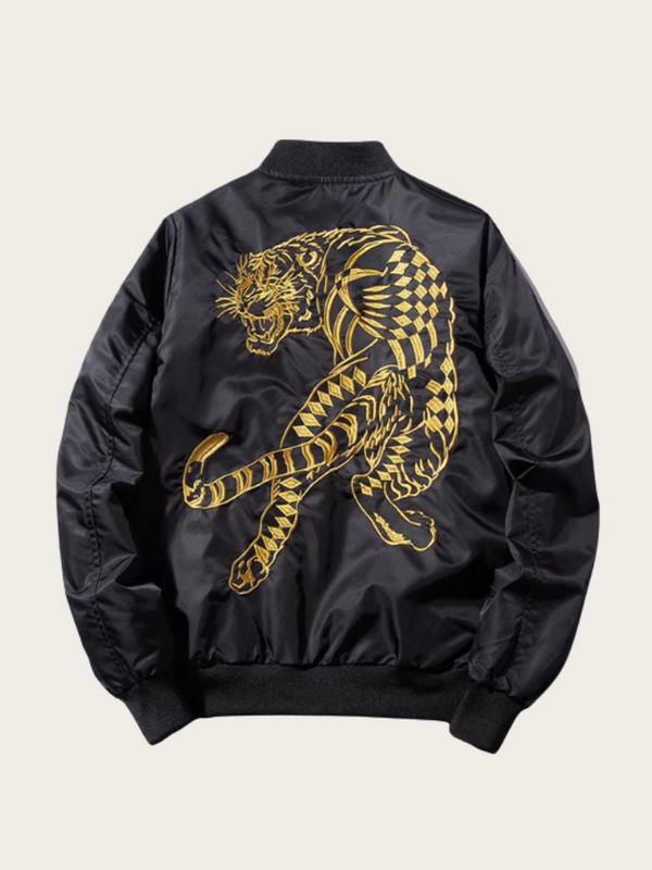 Black jacket with gold tiger design on a beige background