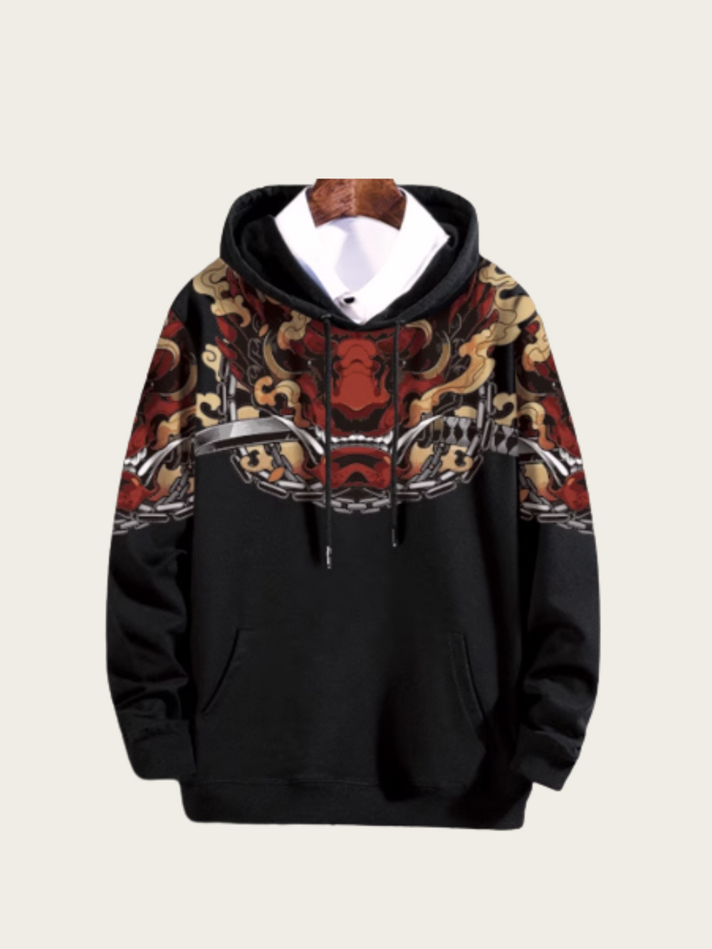 Black hoodie with intricate pattern on the hood against a beige background
