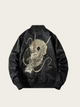 Black jacket with a dragon design on a beige background