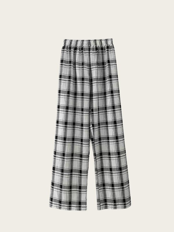 Black and white plaid pants on a beige background