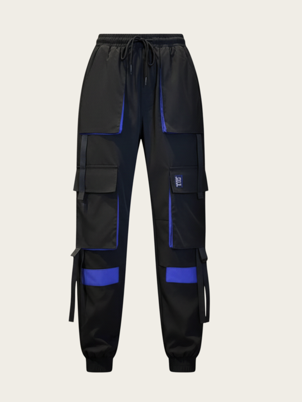 Black cargo pants with blue accents on a beige background