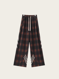 Plaid pants with white accents on a light gray background
