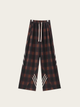 Plaid pants with white accents on a light gray background