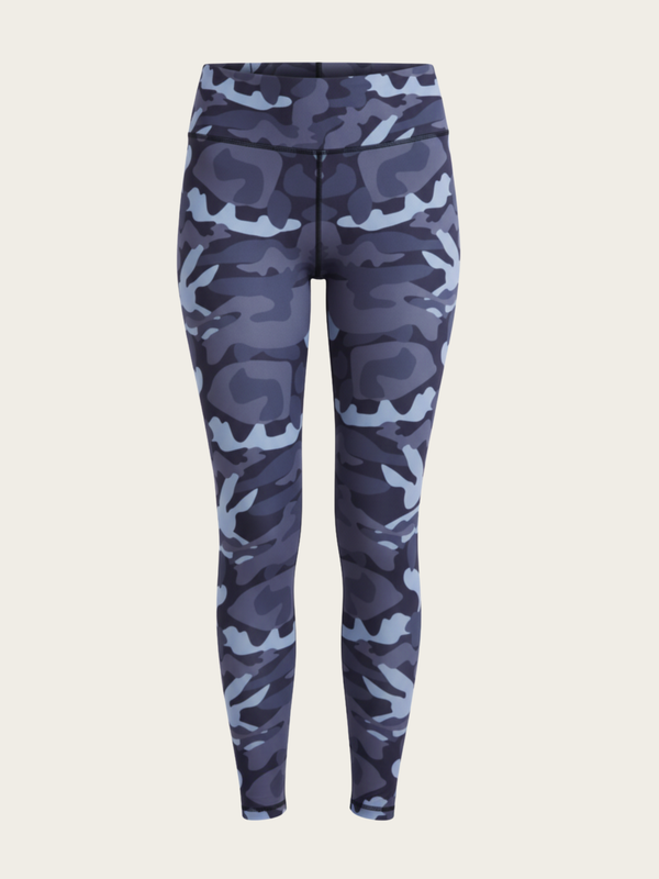 Blue camouflage leggings on a beige background