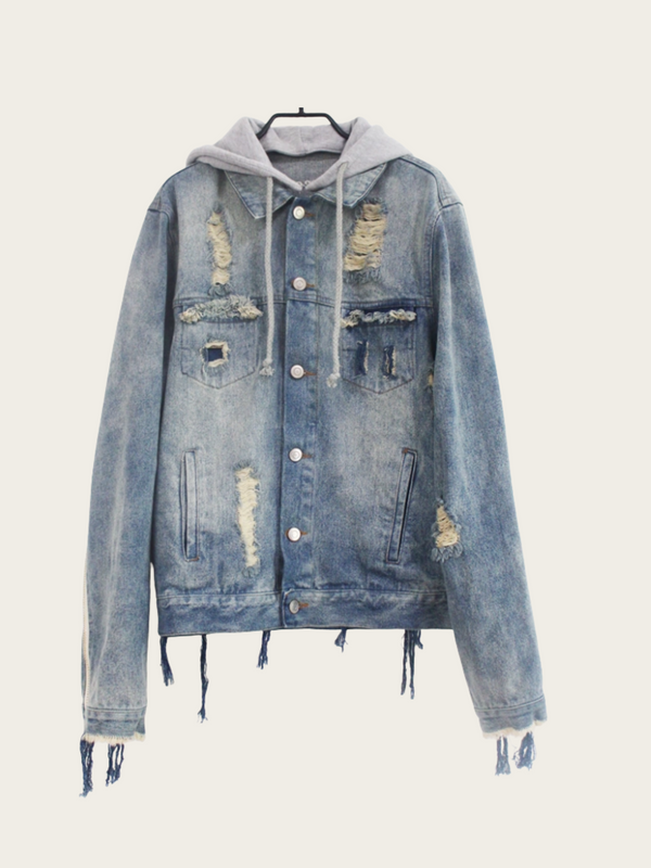 Denim jacket with distressed details on a white background