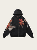 Black hoodie with floral and animal designs on a beige background