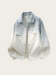 Light blue and white checkered shirt with branding on a beige background