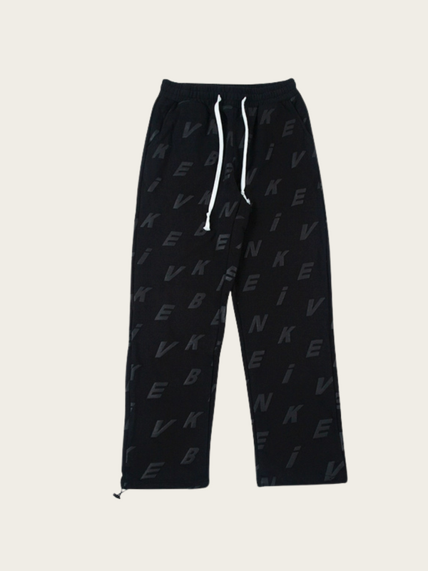 Black sweatpants with a pattern on a white background
