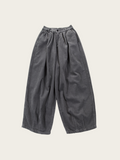 Gray wide-leg pants on a light beige background