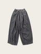 Gray wide-leg pants on a light beige background