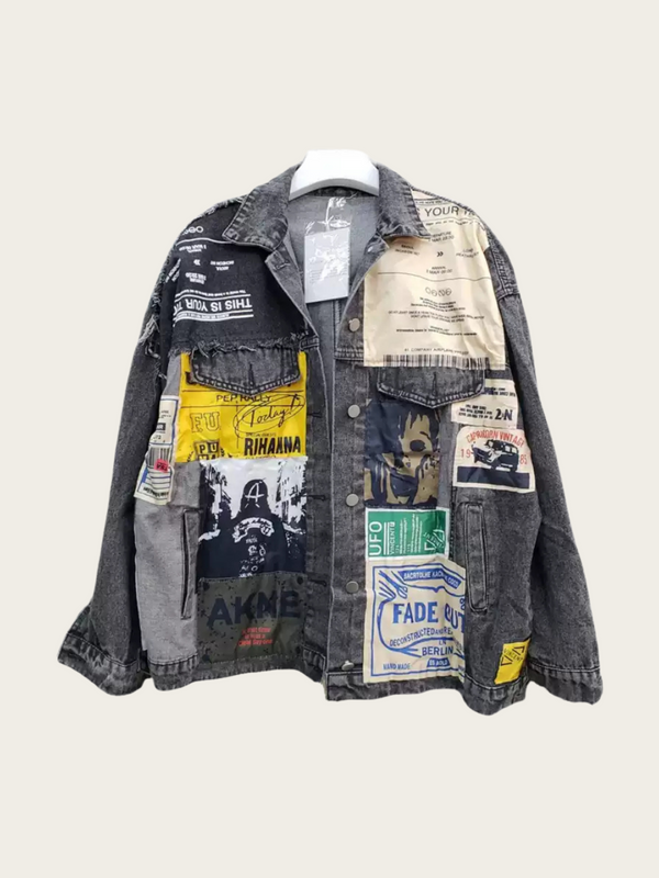 Denim jacket with patches and branding on a light gray background