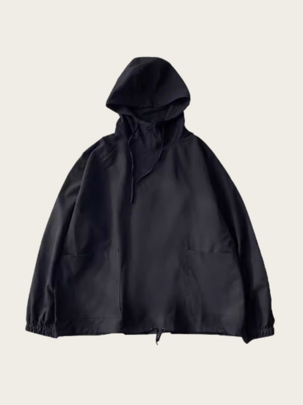 Black hooded jacket on a light beige background