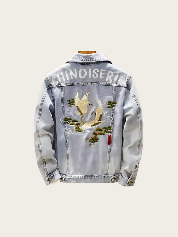 Denim jacket with embroidered design and 'CHINOISERIE' text on a white background
