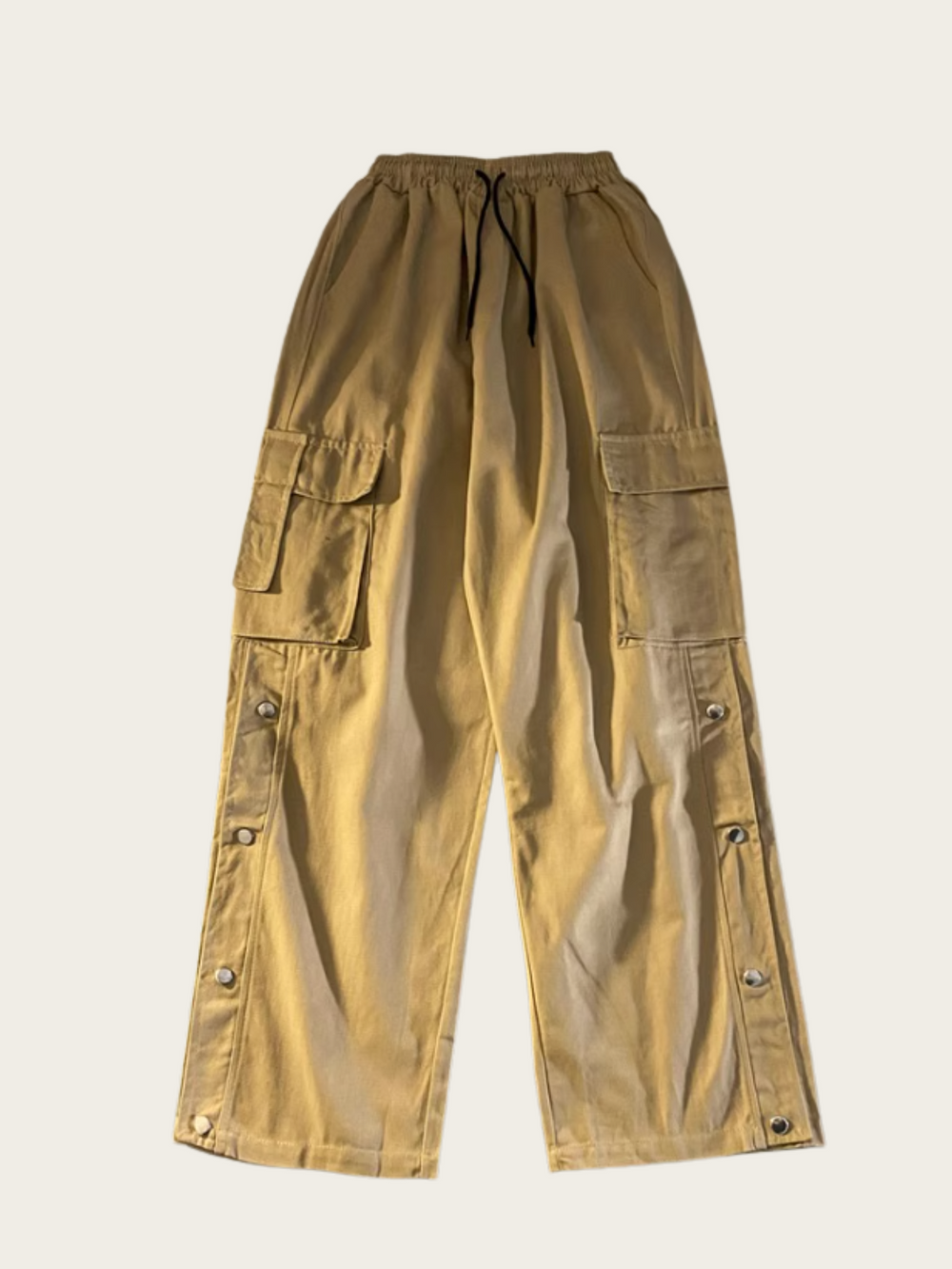 Khaki cargo pants on a beige background