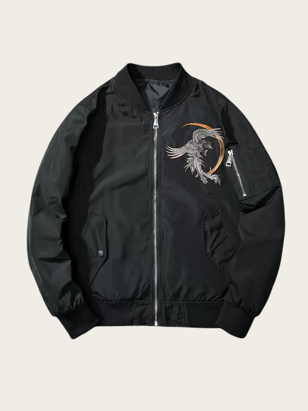 Black bomber jacket with a phoenix design on a beige background